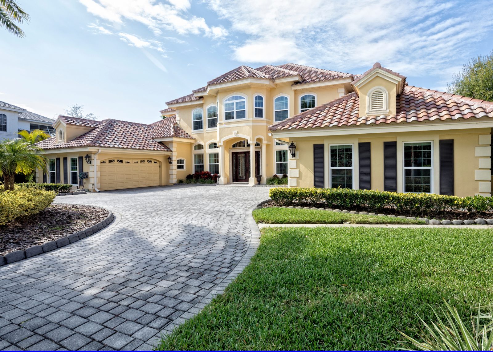 Two-tone exterior house painting by AL's Quality